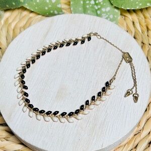 Stella & Dot Sarees Reversible Pulley bracelet, black and white to blood orange